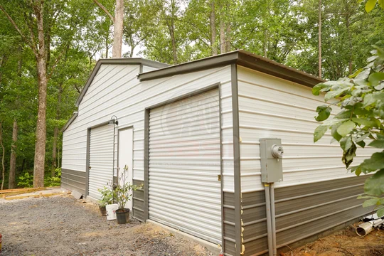 barn with wainscoting, driveway and insulation